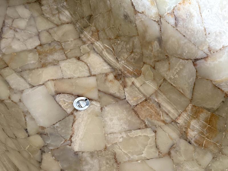 DETAIL OF FREESTANDING STONE BATHTUB POSITANO