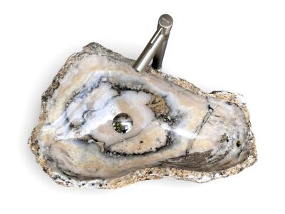 SKULPTURALER WASCHTISCH AUS NATURSTEIN PANIER